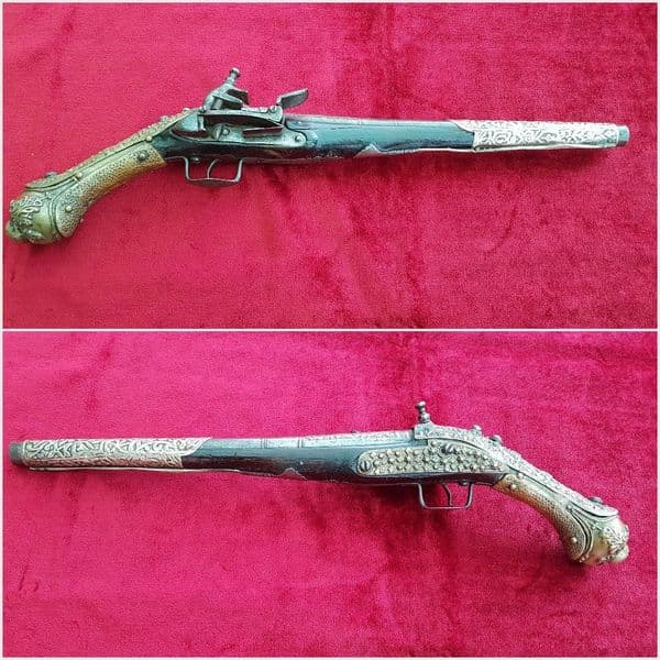 An attractive very long Balkan Miquelet Pistol with heavily embossed mounts.  Circa 1800. Good condition. Ref 9775.